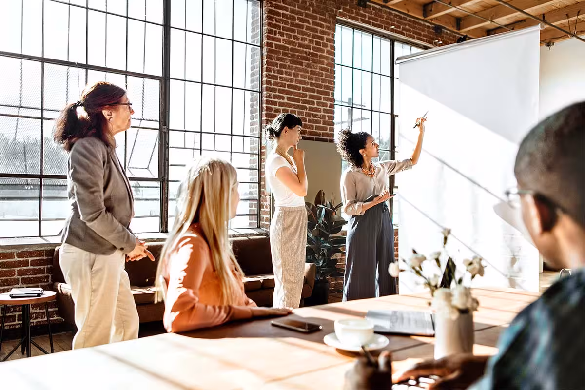 Small business people working in an office setting with group health insurance